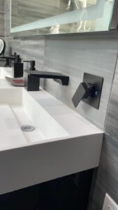 modern sink with dark faucets